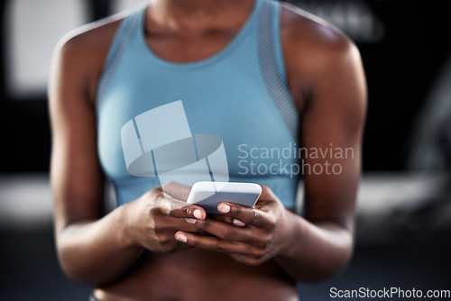 Image of Smartphone, hands or woman in gym on social media to relax on fitness or exercise or workout break. Athlete closeup, texting or girl with mobile app for online digital communication after training