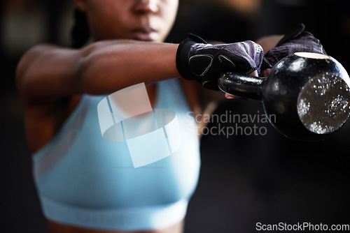 Image of Hands, kettlebell or strong woman in fitness training, workout or bodybuilding exercise for grip strength power. Body builder, blurry closeup or female sports athlete at gym lifting heavy weights