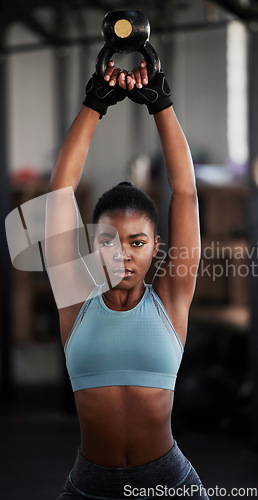 Image of Fitness, kettlebell or portrait of black woman in training, workout or bodybuilding exercise for grip. Body builder, girl power or strong sports athlete with at gym to start lifting heavy weights