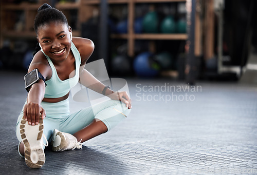 Image of Music, portrait or black woman in gym stretching legs for workout routine or body movement for fitness. Happy, headphones or healthy girl athlete smiling in exercise training warm up for flexibility