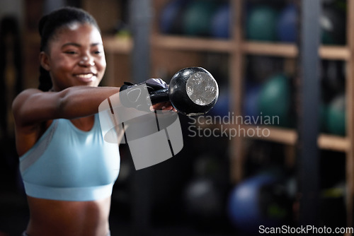 Image of Fitness, kettlebell or happy black woman in training, workout or bodybuilding exercise for grip strength power. Body builder, smile or strong African sports athlete with at gym lifting heavy weights