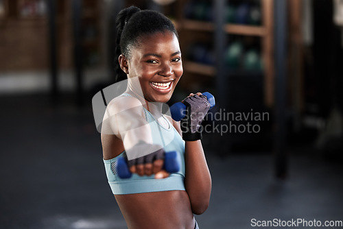 Image of Portrait, dumbbell or happy black woman boxing in training, exercise or workout for a strong punch or power. Smile, face or African girl boxer with dumbbells, weights or exercising in fitness gym