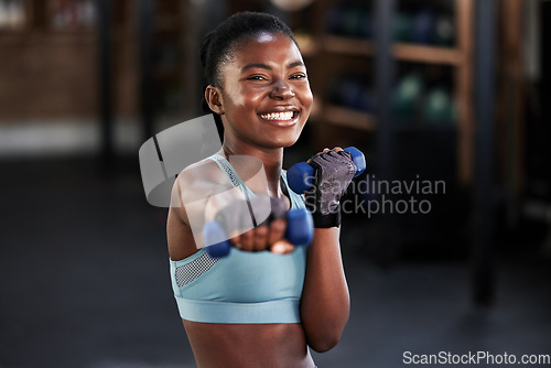 Image of Portrait, dumbbell or happy girl boxing in training, exercise or workout for a strong powerful punch in gym. Smile, face or black woman boxer with dumbbells, weights or exercising in fitness club