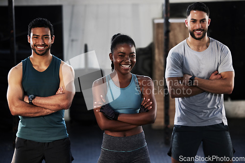 Image of Personal trainer, team portrait or happy people at gym for a workout, exercise or training for healthy fitness. Sports coaches, black woman or instructors with arms crossed or smile in gym studio