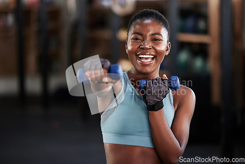 Image of Portrait of boxer, dumbbell or happy black woman training, exercise or workout for a strong punch or power. Smile, face or African girl boxing with dumbbells, weights or exercising in fitness gym