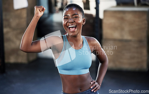Image of Portrait, fitness or happy black woman flexing with strong biceps muscle or body goals in training workout. Exercise, powerful arms or healthy African girl sports athlete excited by results at gym