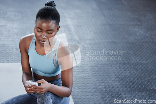 Image of Smartphone, relax or black woman in gym on social media on fitness training, exercise or workout break. Chat, content or African girl athlete texting on mobile app for online digital communication