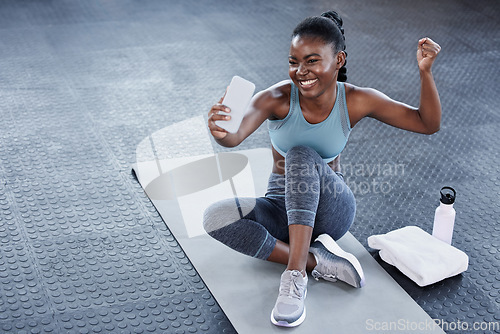 Image of Gym, flexing or happy black woman taking selfie on workout, exercise or training break on social media. Wellness, smile or healthy African girl relaxing or taking pictures for online fitness content