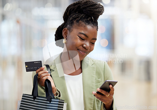 Image of Credit card, face and woman with phone for shopping, sales or smile of person at mall, fashion or shop at clothing store. Girl, discount and mobile payment for purchase, bags and happy customer