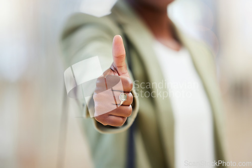 Image of Business woman, hands and thumbs up for winning, success or good job in approval at office. Hand of female person showing thumb emoji, yes sign or like for motivation, win or promotion at workplace