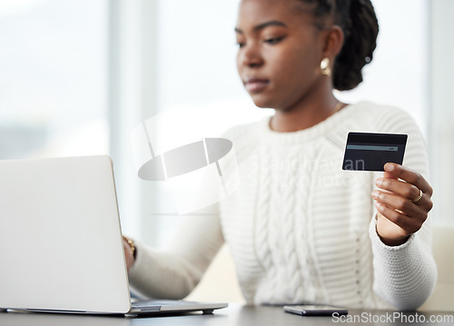 Image of Black woman, laptop and credit card for payment, online shopping or finance on the office desk. African female person or shopper on computer for banking app, purchase or ecommerce at the workplace