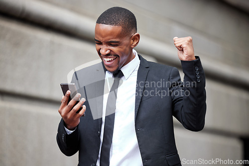 Image of Black man, business and smartphone with celebration in street for winning, trading profit or bonus in city. African businessman, phone and winner on internet for esports, gambling or promotion at job
