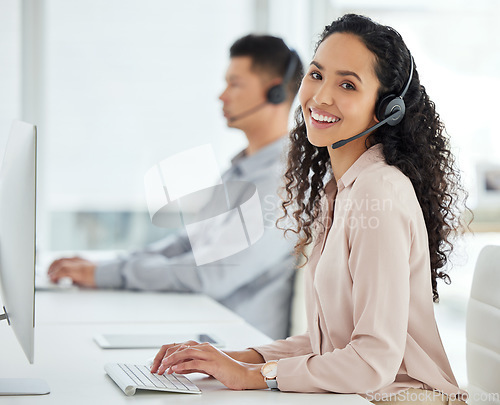 Image of Call center, smile and portrait of a woman at a computer for online support, advice or communication. Happy, contact us and a customer care employee typing on a pc for telemarketing consultation