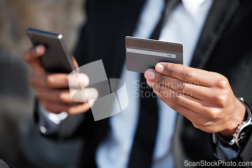 Image of Hands, phone and a credit card for an online payment, shopping or ecommerce. Contact, finance and closeup of a businessman on a mobile app for banking, investing money and paying on the internet