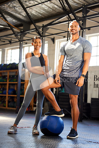 Image of Fitness, gym and portrait of a man and woman with a medicine ball for training, workout or class. Couple of friends as client person and personal trainer at a health and wellness club for exercise
