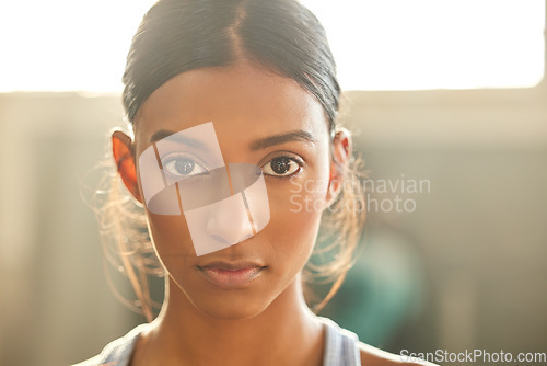 Image of Fitness, portrait or Indian woman at gym for a workout, exercise or training for health or wellness. Face of sports girl or serious female athlete with strong mindset, resilience or focus in studio