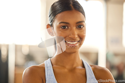 Image of Fitness, portrait or happy Indian woman at gym for a workout, exercise or training for wellness. Face of sports girl or proud female athlete smiling or relaxing with positive mindset in health club