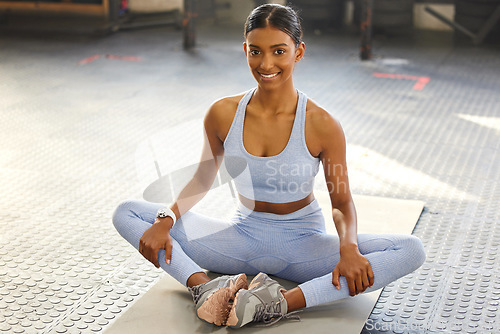 Image of Meditation, yoga and portrait of Indian woman in gym for wellness, mindfulness and breathing exercise on floor. Health, meditate and female person in lotus pose for calm, zen and balance in training