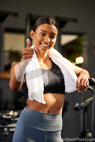 Image of Gym, portrait or happy woman with thumbs up in fitness training with positive mindset or motivation. Wellness, smile or healthy female personal trainer in workout with like hand gesture or thumb up