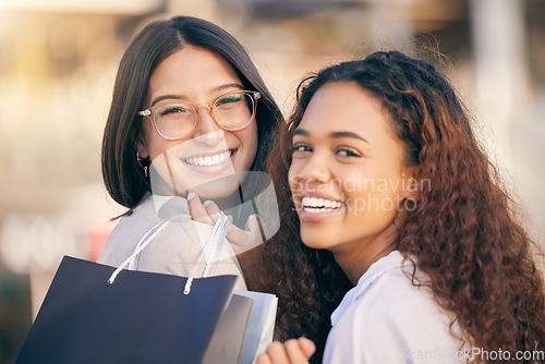 Image of Portrait, shopping and women in a city, retail and happiness with discount, boutique items and buyers. Face, female clients or customers with fashion, sales or consumer choice with a deal and outdoor