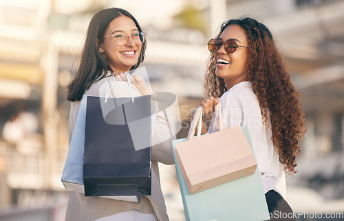 Image of Portrait, retail and women with bags, city or consumer choice with boutique items, fashion or smile. Face, female clients or customers with discount, sale or discount with luxury products or shopping