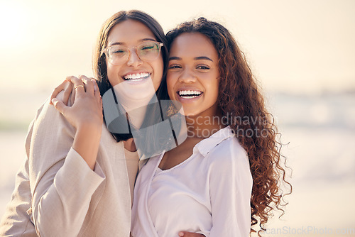 Image of Portrait, lesbian and women hug, beach and love with freedom, equality and romance with happiness. Face, couple and girls embrace, lgbtq relationship and commitment with pride and seaside vacation