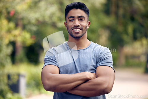 Image of Portrait, fitness and man with arms crossed, outdoor and exercise for wellness, training and workout goal. Face, male person or athlete with health, motivation or sports in a park, happiness and calm