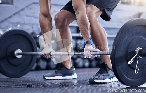 Image of Man, training and lift weight with hands at the gym with legs for wellness with exercise. Male athlete, barbell and workout with hand at a club for strong muscles for lifting the fitness equipment.