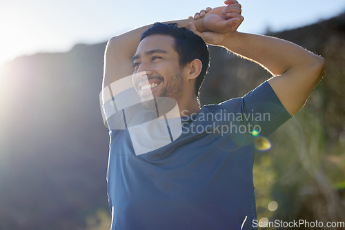 Image of Exercise, thinking and stretching with a man runner outdoor in the mountains for a cardio or endurance workout. Fitness, sports and idea with a young male athlete getting ready for a run in nature