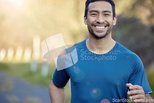 Image of Man, smile in portrait and running outdoor, fitness and cardio with marathon, sports and athlete in nature. Asian male runner, happy with bokeh, exercise and training for race with mockup space