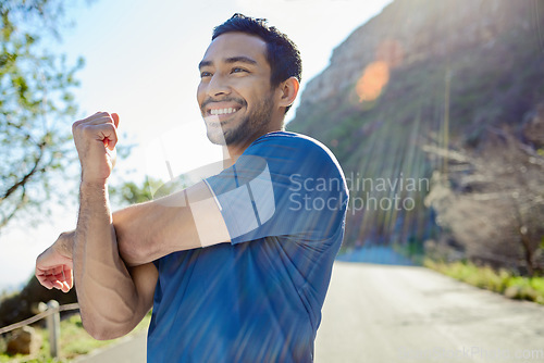 Image of Fitness, thinking and stretching with a man runner outdoor in the mountains for a cardio or endurance workout. Exercise, sports and idea with a young male athlete getting ready for a run in nature