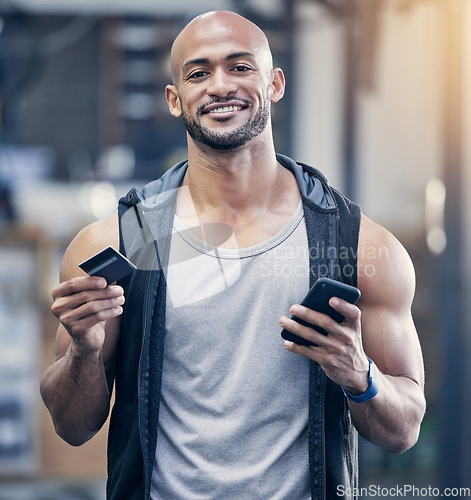 Image of Ecommerce, portrait of man with smartphone and credit card at the gym with a lens flare. Health wellness, workout and happy male athlete with cellphone for online shopping with bank information