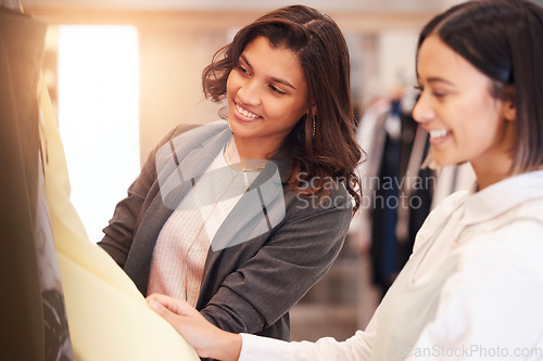 Image of Fashion, retail and customer friends shopping in a mall together while searching for sales in a clothing store. Consumerism, smile, or happy with a woman and friend in a boutique shop to buy clothes