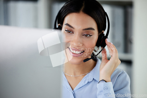 Image of Customer service, woman with a headset and computer at her desk of her modern office workplace. Online communication or crm, support or telemarketing and female call center agent at her workspace