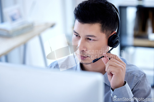 Image of Computer, call center and business man listening for telemarketing, customer service and support. Contact us, crm and male sales agent, professional or consultant with microphone for online help desk