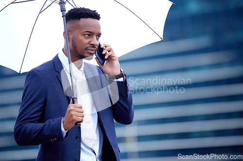 Image of African business man, phone call and umbrella in city, street and communication on walk, travel and winter. Black businessman, smartphone chat and rain in urban metro, cbd and contact for networking