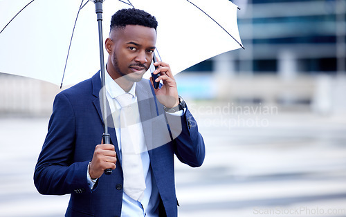 Image of African business man, phone call and umbrella in portrait, street and communication on walk, travel and winter. Black businessman, smartphone and rain in urban metro, cbd and contact for taxi in road