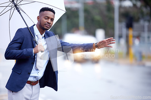 Image of African business, man and transport with wave, taxi or bus in metro street with umbrella in winter rain. Black businessman, city and road for transportation, travel and stop with hand, sign or call