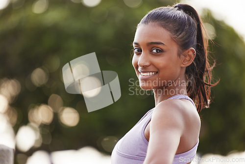 Image of Woman, smile portrait and fitness outdoor of a Indian female person in park for exercise. Workout, mockup and sport of a runner athlete in nature for health, training and wellness with happiness