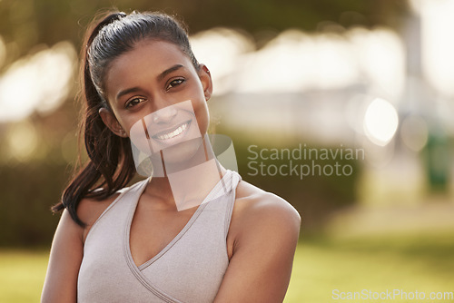 Image of Woman, portrait and fitness outdoor of a Indian female person with a smile from exercise. Workout, mockup and sport of a runner athlete in nature for health, training and wellness with happiness