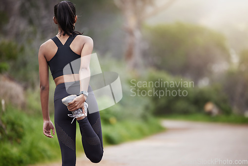 Image of Nature, woman stretching legs and warm up, workout motivation and fitness from back. Dedication, commitment and girl runner on standing on road with leg stretch for outdoor run and exercise goals.