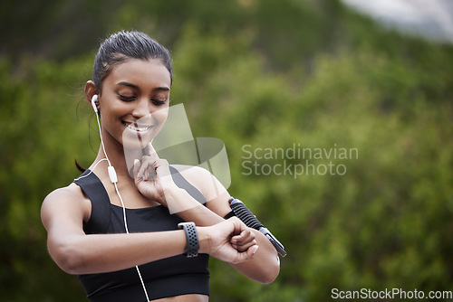 Image of Woman, heart rate check and fitness in a park outdoor with happiness from exercise goal on time. Nature, mockup and female person with a watch monitoring sports, training and workout target on run