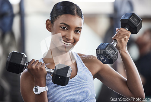 Image of Portrait of woman in gym, dumbbell and smile for weightlifting, power and muscle at sports club. Balance, fitness and female bodybuilder holding weights and training with health goals and happiness.