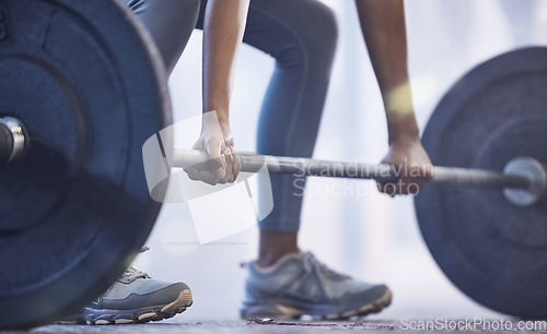 Image of Gym, woman with barbell for weightlifting and fitness, power and muscle with closeup on hands at sports club. Challenge, zoom and strong female bodybuilder with weights and training with health goals