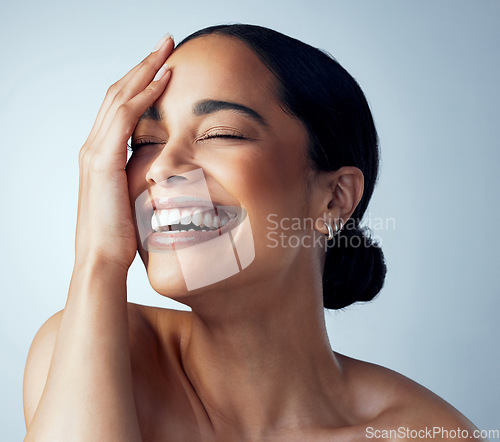 Image of Hand, skincare and and happy woman in studio for body care, self love and natural cosmetic on grey background. Smile, dermatology and female model relax with luxury wellness, beauty and glowing skin