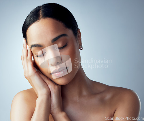 Image of Skincare, face and woman in studio for natural, dermatology and cosmetic on grey background. Soft, skin and female model relax with calm, pamper and luxury glow or treatment, self love or routine