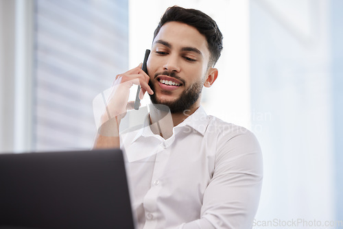 Image of Phone call, laptop and businessman working in the office while talking on cellphone for communication. Happy, smile and professional male employee on mobile conversation while doing company research.