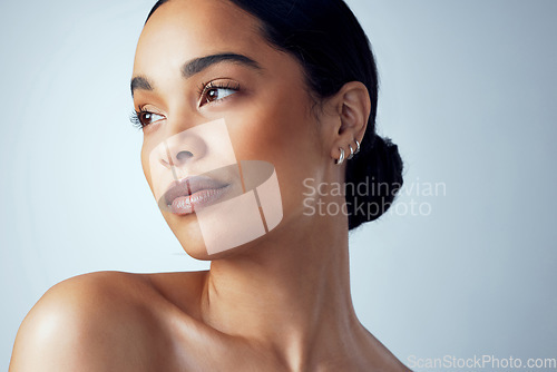 Image of Thinking, skincare and woman in studio with natural beauty, cometic and wellness on grey background. Daydreaming, face and female model relax with dermatology, treatment and self care skin routine