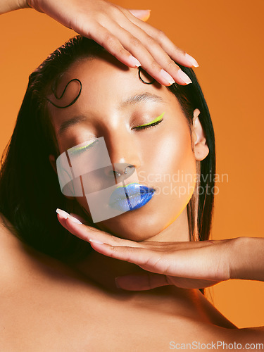 Image of Neon makeup, cosmetics and face of woman in studio for art deco, eye shadow and beauty salon. Creative aesthetic, cosmetology and female person with blue lipstick for glamour, luxury style and glow