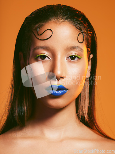 Image of Makeup, cosmetic art and portrait of woman in studio for cosmetics, eye shadow and beauty. Aesthetic, creative cosmetology and face of female person with blue lipstick for glamour, fashion and style